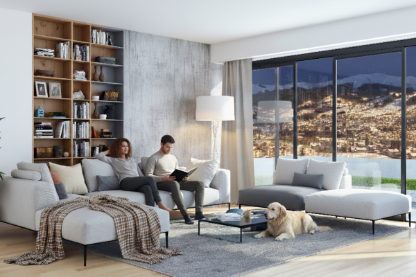 Mann und Frau mit Hund im Wohnzimmer
